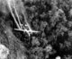 Vietnam: A U.S. Air Force C-123 flies low along a South Vietnamese highway in May 1966 while spraying defoliants on dense jungle growth to eliminate ambush sites for the NLF (Viet Cong) during the Vietnam War.