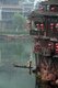China: Boatman collecting river weed early morning on Fenghuang's Tuo River, Fenghuang, Hunan Province